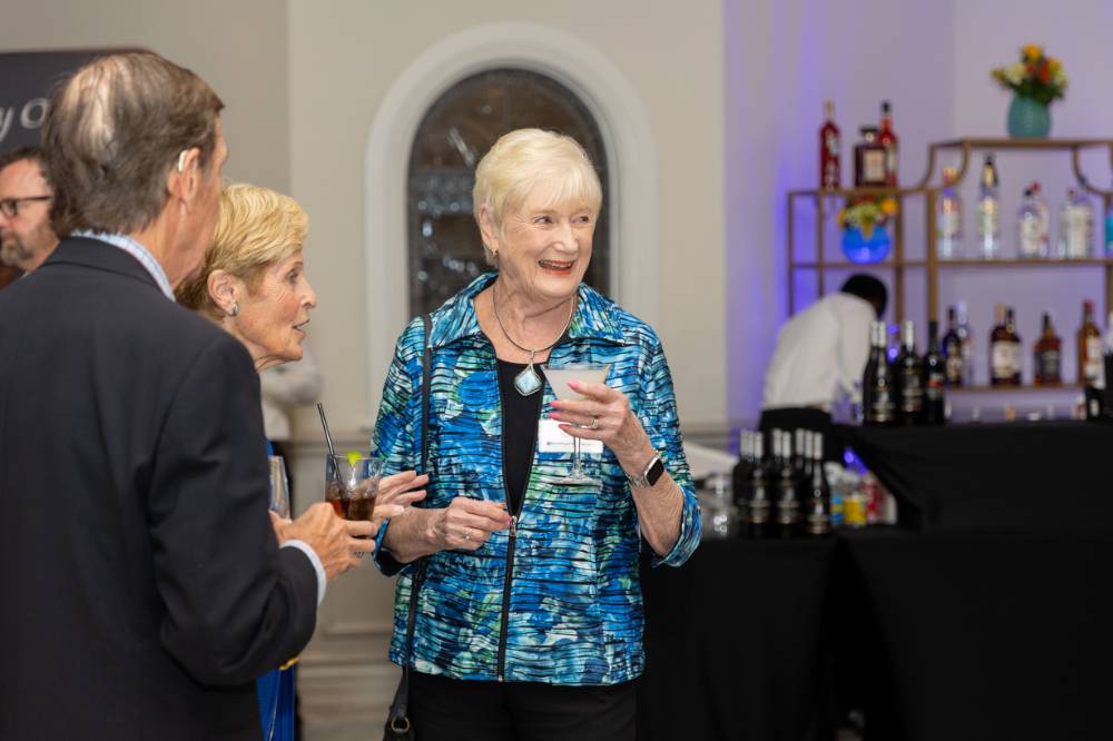 Female guest smiling at someone off camera